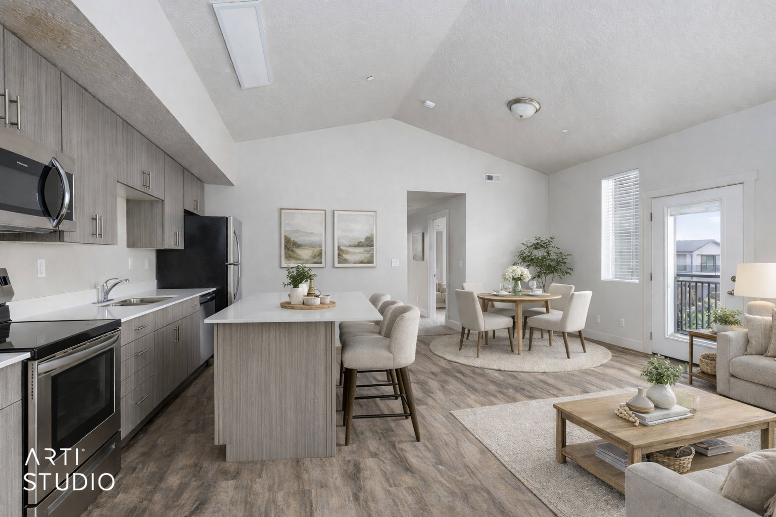 Kitchen featuring stainless steel appliances, a kitchen breakfast bar, a center island, open floor plan, and dark wood-type flooring
