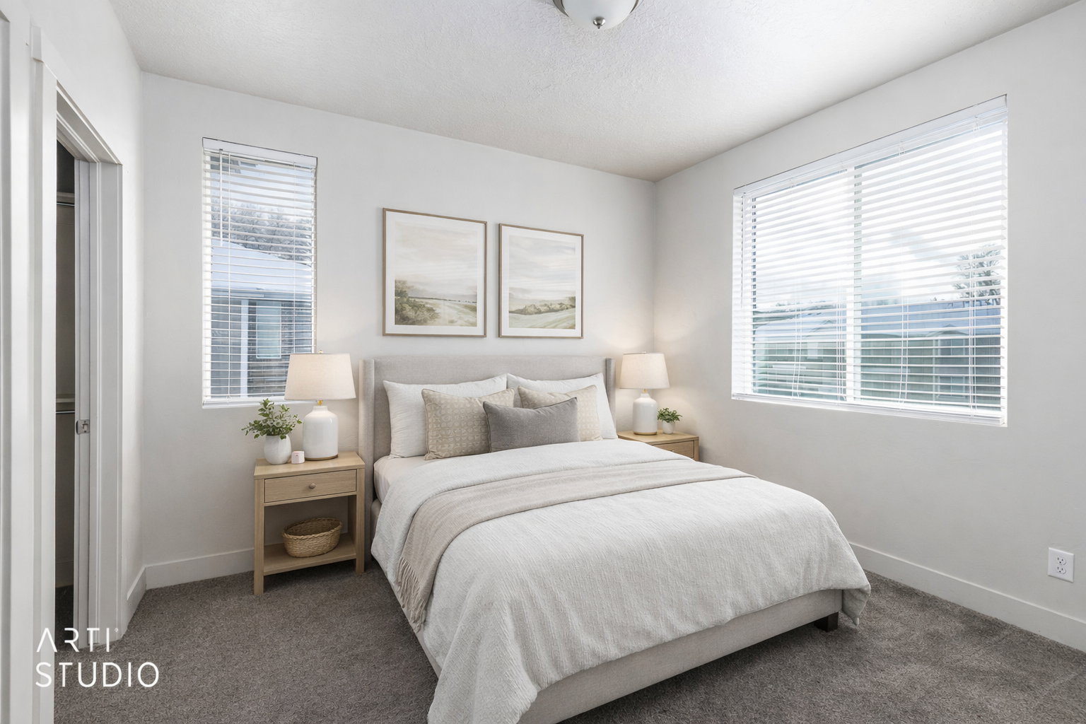 Bedroom with multiple windows and carpet