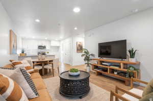 Living area featuring recessed lighting and light wood-style flooring