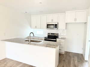 Beautiful white cabinets with stainless steel appliances & granite countertops