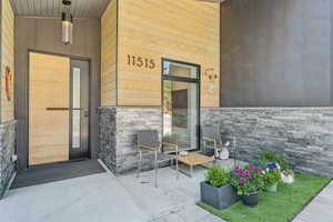 View of exterior entry with stone siding