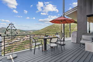 Deck featuring a mountain view and a grill
