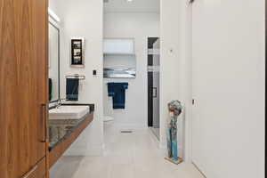 Full bath featuring vanity and a stall shower