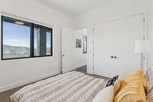 Bedroom with baseboards and a closet