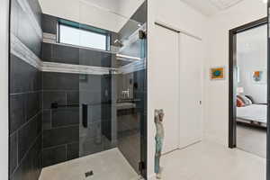 Bathroom with ensuite bath and a stall shower