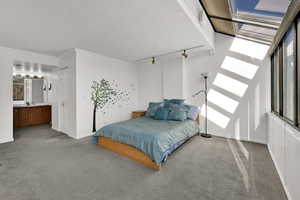 Large primary bedroom with huge greenhouse windows, and incredible east-facing mountain views