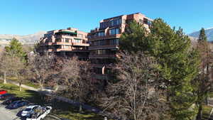 View of apartment building / complex featuring a mountain view