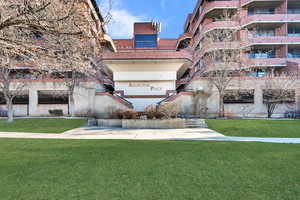 View of community featuring a yard