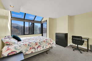 2nd bedroom or office with direct balcony access,  huge greenhouse windows and incredible east-facing mountain view