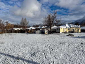 View of yard layered in snow
