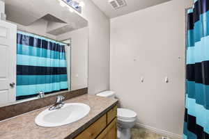 Full bath featuring a shower with curtain and vanity