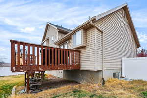 View of side of property with a deck