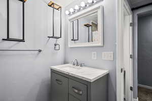 Full bath with vanity and curtained shower