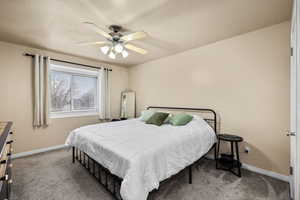 Bedroom with carpet and ceiling fan