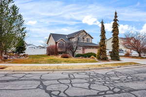 Traditional home with a garage and concrete driveway