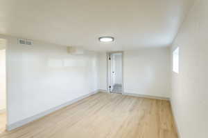 Empty room featuring light wood-style flooring and baseboards