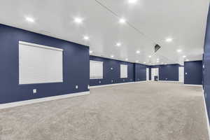 Empty room featuring carpet flooring and recessed lighting