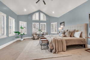 Bedroom featuring carpet, high vaulted ceiling, and ceiling fan