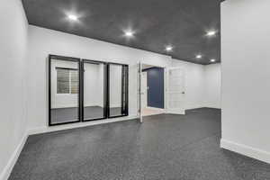 Spare room with recessed lighting, french doors, and a textured ceiling