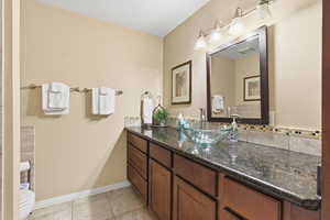 Bathroom with vanity and light tile patterned floors