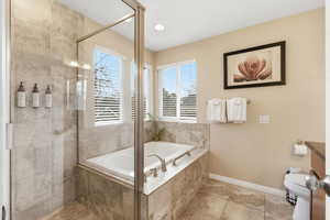 Bathroom with a garden tub, a stall shower, recessed lighting, and light tile patterned floors