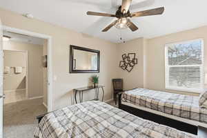 Bedroom featuring light carpet and ceiling fan