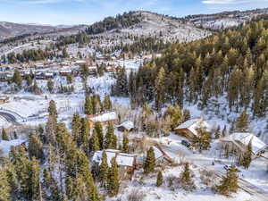 Snowy aerial view featuring a mountain view