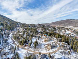 Snowy aerial view featuring a mountain view