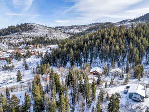 Snowy aerial view with a mountain view