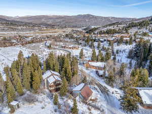 Snowy aerial view with a mountain view