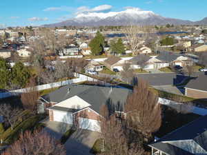 Aerial view of residential area featuring a mountainous background