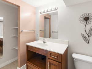 Bathroom with vanity and light tile patterned floors