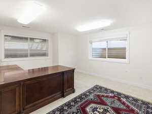 Unfurnished office with baseboards