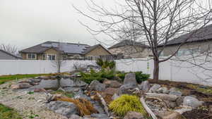 View of fenced backyard