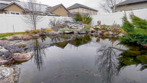 Water view featuring a fenced backyard