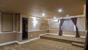 Carpeted spare room with recessed lighting and a wall mounted air conditioner