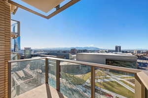 Balcony with a view of city and a mountain view