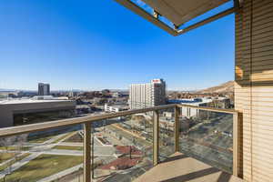 Balcony featuring a view of city
