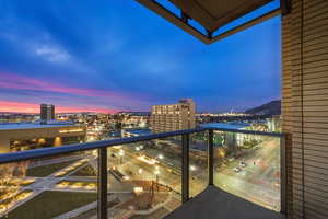 Balcony at dusk with a view of city