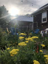 View of yard featuring a sunroom