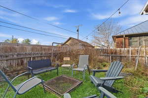 Fenced backyard featuring a patio area