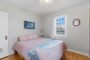 Bedroom featuring light wood finished floors and a ceiling fan