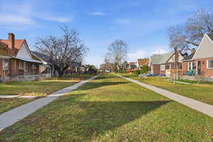 View of grassy yard with a residential view