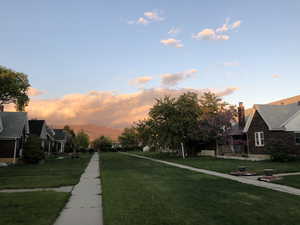 View of street with sidewalks and a mountain view