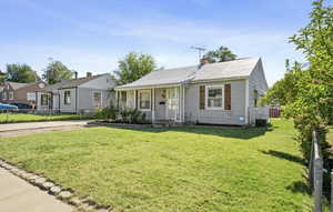 Bungalow-style house with covered porch and a chimney