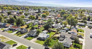 Aerial perspective of suburban area with a mountain backdrop