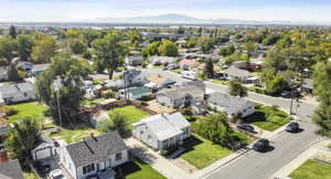 Aerial view of residential area with a mountainous background