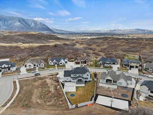 Aerial view of residential area featuring a mountainous background