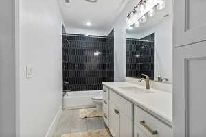 Bathroom with vanity and shower / bath combination
