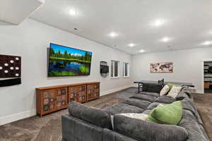 Living area featuring carpet floors and recessed lighting